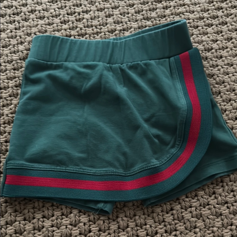 Green Shorts with Red Stripe